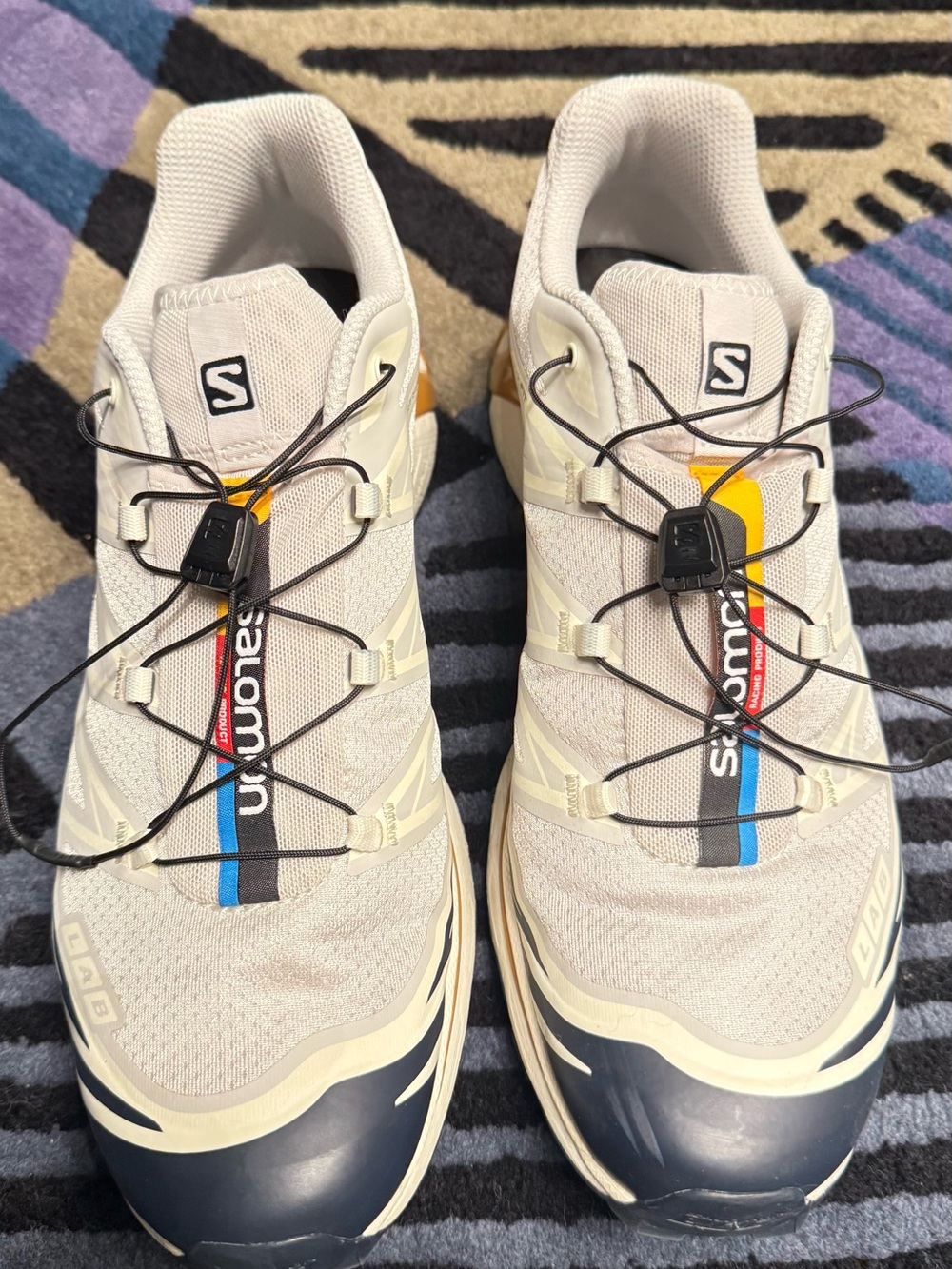 Salomon Men's Beige Trail Sneakers with Black Toe and Blue/Yellow Accent